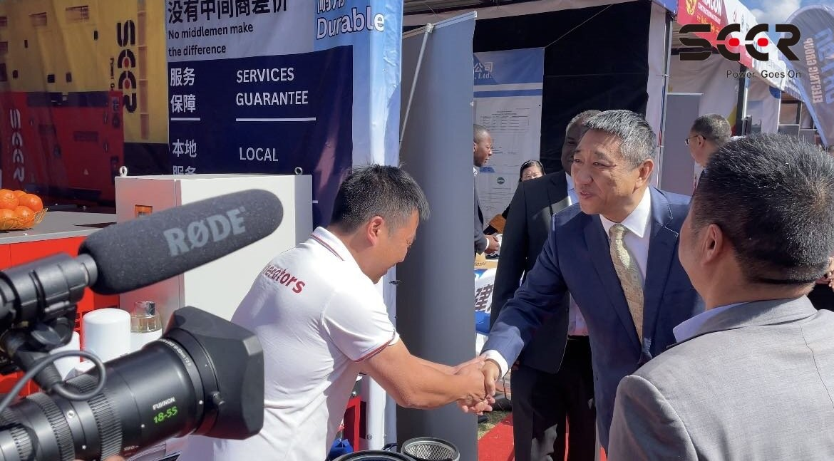 Visitors speaking with the SEER POWER team at the exhibition booth.