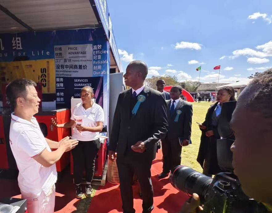 Discussions at the SEER POWER booth during the Zambia exhibition.